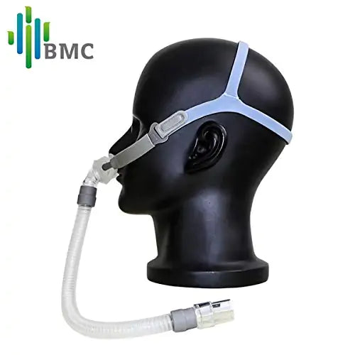 BMC P2 NASAL PILLOW MASK fitted on mannequin head with headgear and tubing for sleep therapy