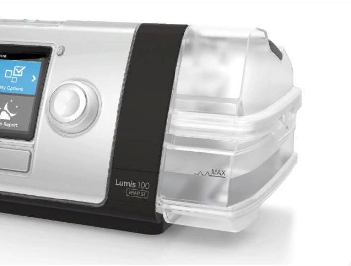 Close-up of Resmed Lumis 100 VPAP ST BiPAP machine showing control knob and humidifier chamber