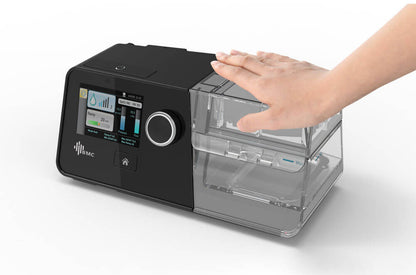 BMC G3 Auto A20 CPAP system with digital display and water chamber shown with hand adjusting humidifier