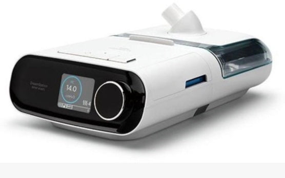 Philips DreamStation BiPAP AVAPS 30 white respiratory therapy device with digital display and humidifier