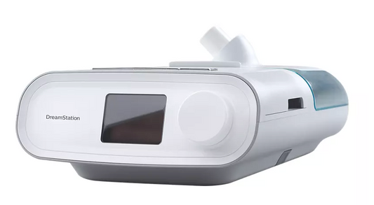 philips Respironics DreamStation CPAP machine with digital display and control knob in white