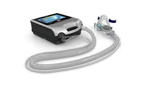 Resmed Astral 150 portable ventilator with connected breathing circuit and mask for respiratory support
